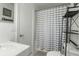 Clean bathroom features a shower with striped curtain and tile floors at 303 Lakeside Dr # C-2, Mount Pleasant, SC 29464