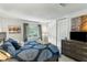 A cozy bedroom filled with natural light, complimented by neutral walls and decor at 303 Lakeside Dr # C-2, Mount Pleasant, SC 29464