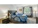 Comfortable bedroom with a large bed, bedside table, and window with natural light at 303 Lakeside Dr # C-2, Mount Pleasant, SC 29464