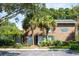 Beautiful brick building with well-maintained landscaping and mature palm trees at 303 Lakeside Dr # C-2, Mount Pleasant, SC 29464
