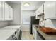 Well-equipped kitchen with modern appliances, washer and dryer, and ample cabinet space at 303 Lakeside Dr # C-2, Mount Pleasant, SC 29464