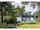 Scenic lake view with a bench, trees, and calm water, creating a peaceful and inviting outdoor space at 303 Lakeside Dr # C-2, Mount Pleasant, SC 29464