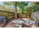 Private outdoor patio area with brick pavers and charming garden decor at 303 Lakeside Dr # C-2, Mount Pleasant, SC 29464