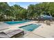 Community pool with several lounge chairs providing ultimate relaxation at 303 Lakeside Dr # C-2, Mount Pleasant, SC 29464