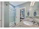 Modern bathroom featuring a dual sink vanity with granite counters and a glass-enclosed shower at 311 Citation Way, Moncks Corner, SC 29461