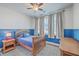Cozy bedroom with natural light, wood furniture, and a soft rug at 311 Citation Way, Moncks Corner, SC 29461