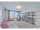Bright bonus room featuring comfortable seating, built-in shelving, and ample natural light at 311 Citation Way, Moncks Corner, SC 29461