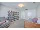 Versatile bonus room with a bookcase, chair, trundle bed, and ample natural light at 311 Citation Way, Moncks Corner, SC 29461