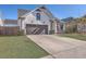 Well-maintained single-Gathering home with a spacious driveway and manicured front lawn at 311 Citation Way, Moncks Corner, SC 29461