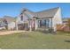 Attractive single-Gathering home with a verdant lawn, flag, and attached two-car garage at 311 Citation Way, Moncks Corner, SC 29461