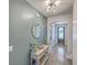 Entryway featuring a console table, arched doorway, and stylish mirror at 311 Citation Way, Moncks Corner, SC 29461