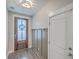 Inviting foyer with a wood-look door and coat hooks at 311 Citation Way, Moncks Corner, SC 29461