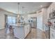 Spacious kitchen featuring a central island, granite counters, stainless steel appliances, and open flow to dining area at 311 Citation Way, Moncks Corner, SC 29461