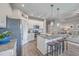 Modern kitchen with stainless steel appliances, white cabinets, granite counters, and island with barstool seating at 311 Citation Way, Moncks Corner, SC 29461