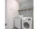 Well-organized laundry room featuring modern appliances and stylish wallpaper at 311 Citation Way, Moncks Corner, SC 29461