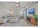 Inviting living room featuring a plush sofa, stylish ottoman, and natural light at 311 Citation Way, Moncks Corner, SC 29461