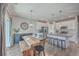 Bright living space showcasing an open floor plan with dining, kitchen, and island with barstool seating at 311 Citation Way, Moncks Corner, SC 29461