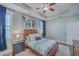 Comfortable main bedroom with ample natural light, modern decor, and a ceiling fan at 311 Citation Way, Moncks Corner, SC 29461