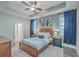 Relaxing main bedroom featuring a tray ceiling, a ceiling fan, two windows, and neutral paint at 311 Citation Way, Moncks Corner, SC 29461
