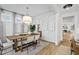 Elegant dining room featuring a wooden table, stylish chairs, and a modern pendant light at 325 Abercom Place Dr, Moncks Corner, SC 29461
