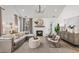 Bright living room with gray furniture, a fireplace, and a large window for natural light at 325 Abercom Place Dr, Moncks Corner, SC 29461