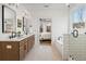 Spacious main bathroom featuring double vanities, a soaking tub, and a glass-enclosed shower at 325 Abercom Place Dr, Moncks Corner, SC 29461