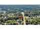 Aerial neighborhood view showcasing lush surroundings with a pin drop marking the property's location amid abundant trees at 3316 Island Estates Dr, Johns Island, SC 29455