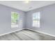 This bedroom has two windows allowing for lots of light and laminate flooring at 3316 Island Estates Dr, Johns Island, SC 29455