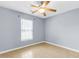 This bedroom features tile flooring, a ceiling fan, and a window for natural light at 3316 Island Estates Dr, Johns Island, SC 29455