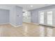 Bright open dining area adjacent to the kitchen with views to the back through glass panel doors at 3316 Island Estates Dr, Johns Island, SC 29455