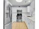 Updated kitchen with stainless steel appliances, white cabinets, and modern countertops at 3316 Island Estates Dr, Johns Island, SC 29455