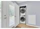 Convenient laundry area with stacked washer and dryer off the kitchen, maximizing space and efficiency at 3316 Island Estates Dr, Johns Island, SC 29455