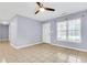 Inviting living room with ceiling fan, neutral walls and tile floors, creating a comfortable atmosphere at 3316 Island Estates Dr, Johns Island, SC 29455