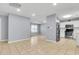 Open living area with tile floors, natural light and flows into the kitchen for easy entertaining at 3316 Island Estates Dr, Johns Island, SC 29455