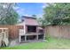 Backyard outdoor grill made of brick with a prep surface next to a wooden fence at 3316 Island Estates Dr, Johns Island, SC 29455