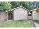 Exterior view of a backyard shed with a light brown exterior and an awning at 3316 Island Estates Dr, Johns Island, SC 29455