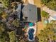 Aerial view featuring a home's roof, pool and deck surrounded by trees at 3323 Myrtle St, Edisto Island, SC 29438