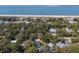Aerial view of coastal homes surrounded by lush trees near the beach at 3323 Myrtle St, Edisto Island, SC 29438