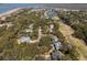 An aerial view of the home's neighborhood highlighting its proximity to the coast and a golf course at 3323 Myrtle St, Edisto Island, SC 29438