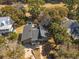 Aerial view of the property showcasing its wooded lot and proximity to the golf course at 3323 Myrtle St, Edisto Island, SC 29438