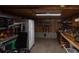 Unfinished basement with a refrigerator, shelving, and ample storage space for tools and equipment at 3323 Myrtle St, Edisto Island, SC 29438