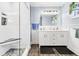Modern bathroom with glass-enclosed shower, dual sinks, and stylish fixtures at 3323 Myrtle St, Edisto Island, SC 29438