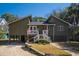 Beautiful raised beach house with landscaped yard, and charming front porch perfect for relaxing at 3323 Myrtle St, Edisto Island, SC 29438