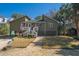 Charming raised beach home featuring a quaint front porch and inviting curb appeal at 3323 Myrtle St, Edisto Island, SC 29438