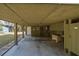 Expansive carport with an outdoor shower offering convenience and functionality by the beach at 3323 Myrtle St, Edisto Island, SC 29438