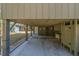 A spacious covered parking area with an outdoor shower and storage solutions, perfect for beachside living at 3323 Myrtle St, Edisto Island, SC 29438
