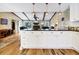 Bright, open kitchen featuring white cabinetry, stainless steel appliances, and a large island at 3323 Myrtle St, Edisto Island, SC 29438