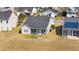 Charming home with screened-in porch, gray roof, and well-maintained lawn at 3707 Blackjack Rd, Ladson, SC 29456