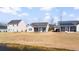 Expansive backyard featuring a pond and screened-in porch, perfect for relaxing and enjoying the outdoors at 3707 Blackjack Rd, Ladson, SC 29456