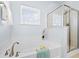 Bright bathroom featuring a soaking tub with window and a glass enclosed shower at 3707 Blackjack Rd, Ladson, SC 29456